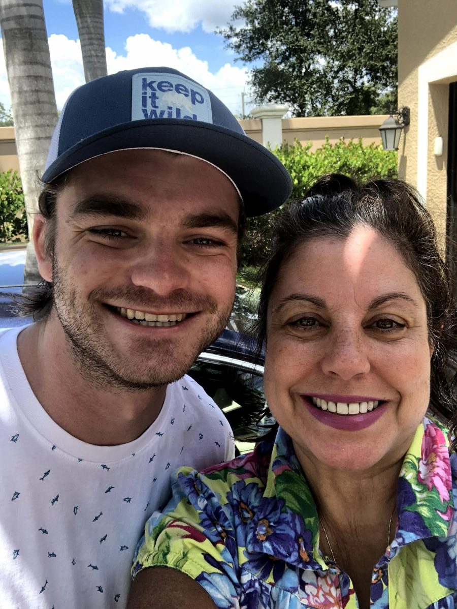 Ian grown, in a “keep it wild” cap, cheek to cheek with his aunt Celine on a bright day.